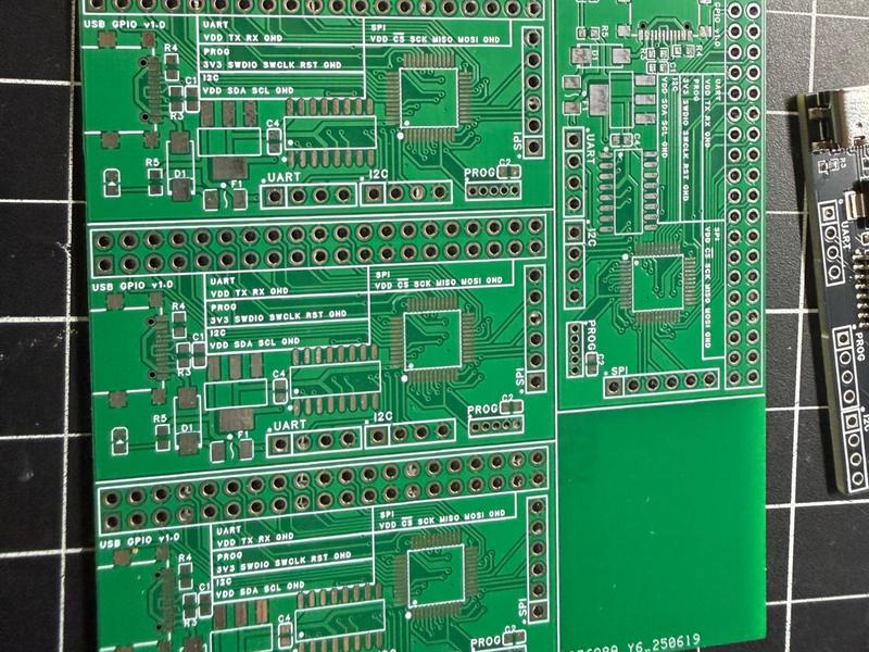 Unpopulated green PCB panel of Doer USB GPIO boards