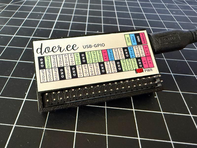 Finished Doer USB GPIO in a 3D-printed case with a color-coded pinout label