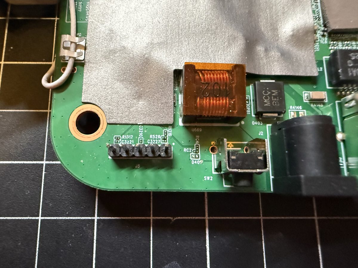 W1700K UART console header, next to the reset button and DC power jack