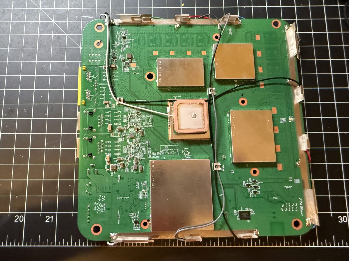 The Airoha AG3352Q GNSS module board, removed, with its patch antenna visible