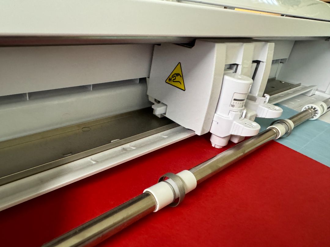 Laser cutter cutting paper showing precision detail